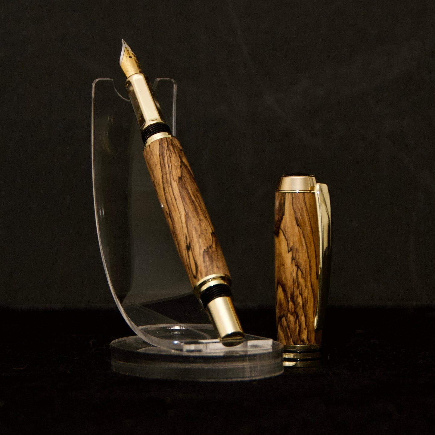 handmade fountain pen made from spalted tamarind wood with gold and black hardware